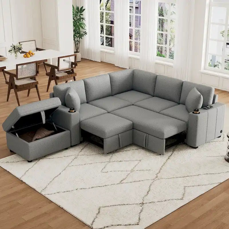 Divano componibile a L beige/grigio con letto estraibile e pouf contenitore